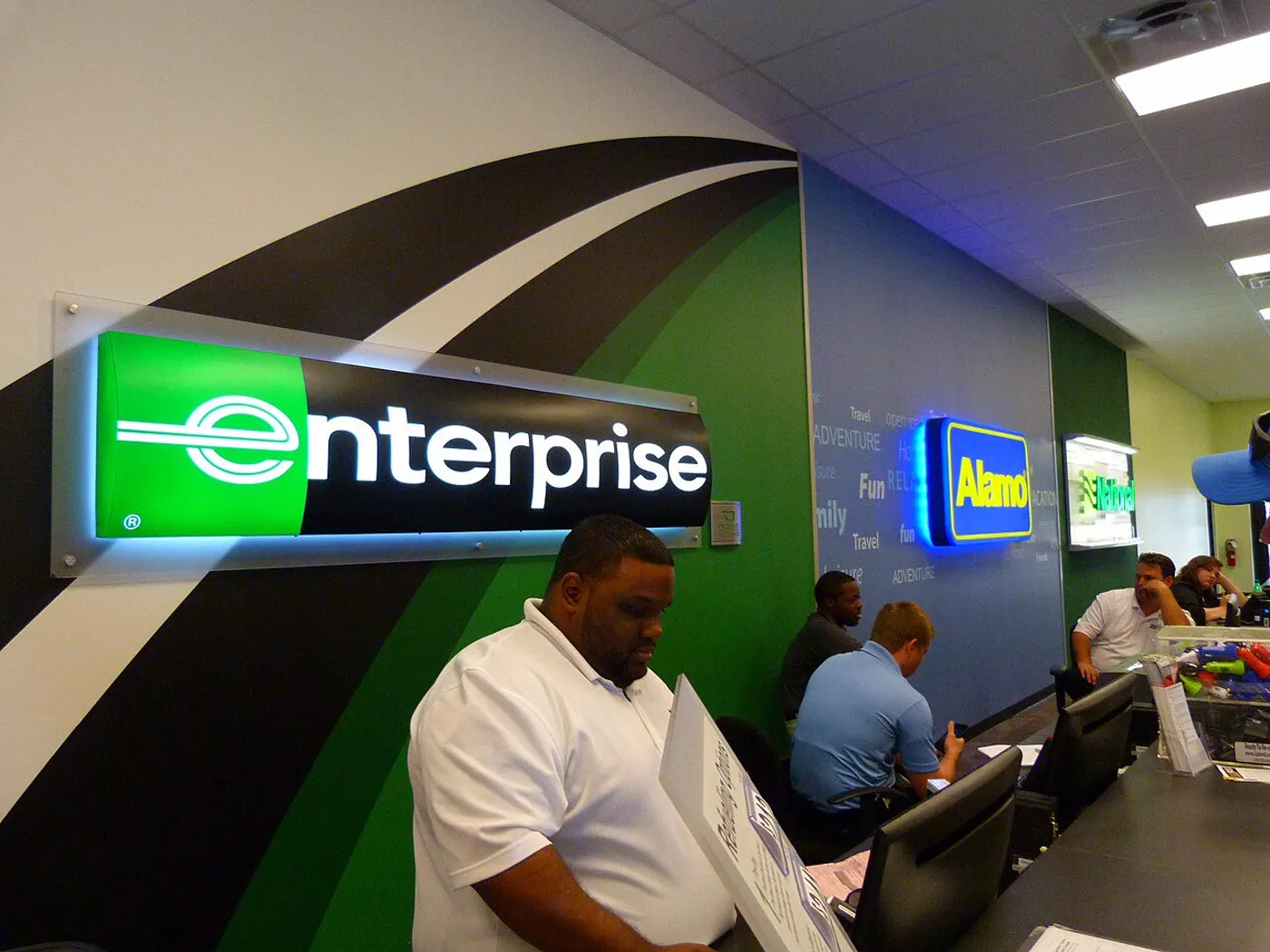 Rental company counters inside an airport rental center