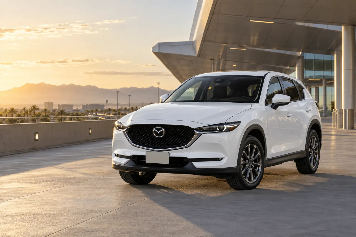 White 2026–2027 Mazda CX-5 Compact SUV at an airport terminal at golden hour