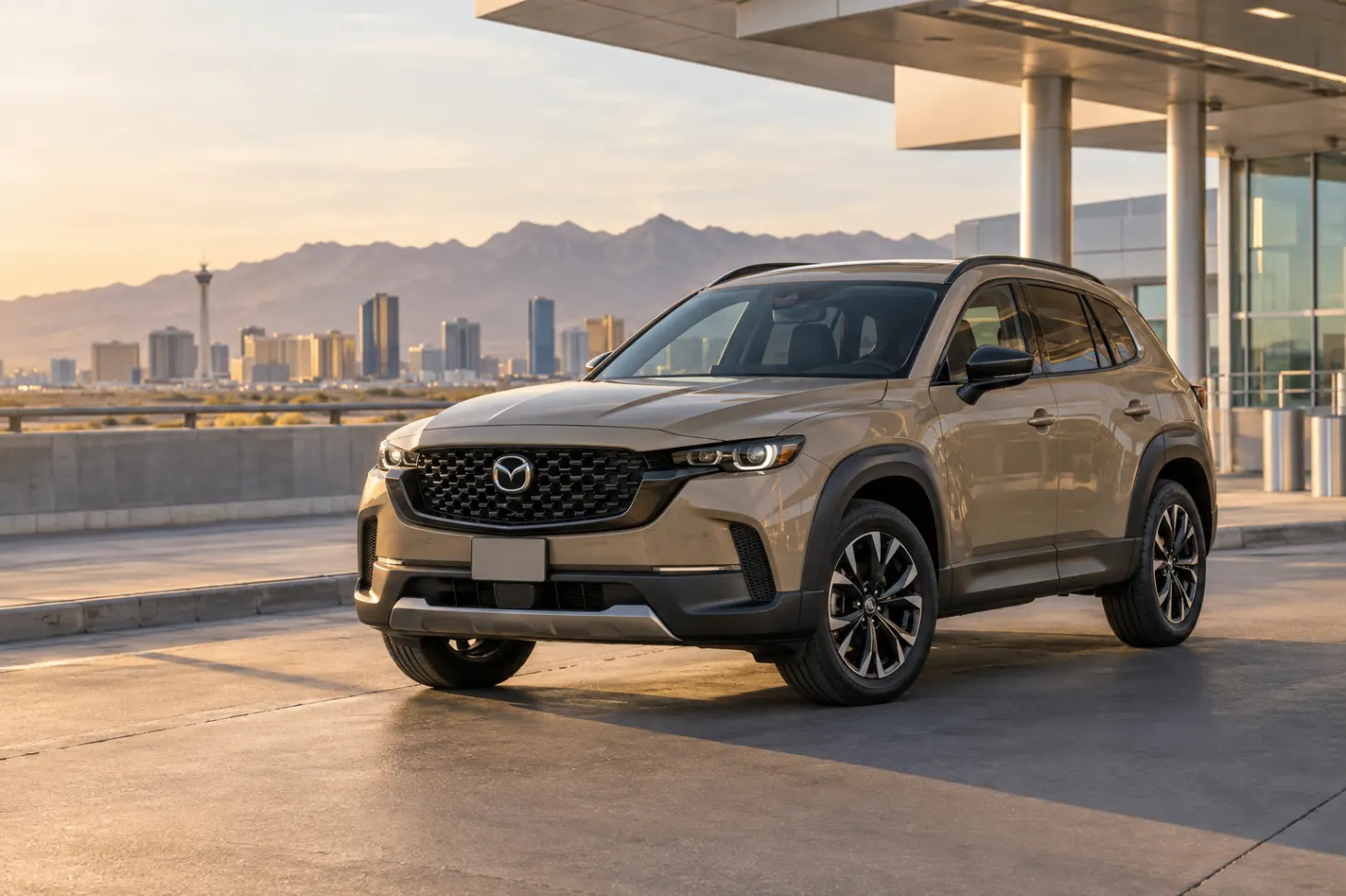 Sand 2026–2027 Mazda CX-50 Compact SUV at an airport terminal at golden hour